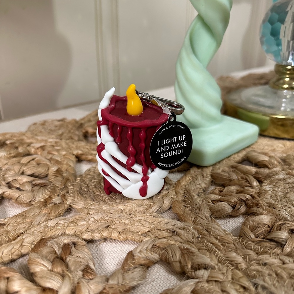 Bath and body works glow in the dark and music playing sanitizer holder.